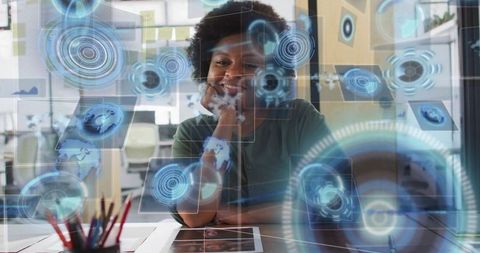Smiling woman interacting with holographic analytics dashboards in modern open workspace