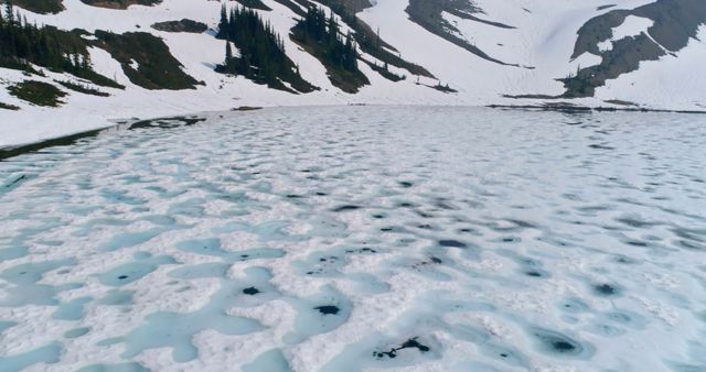 Frozen Alpine Lake with Snow-Covered Mountains and Pine Trees - Download Free Stock Images Pikwizard.com