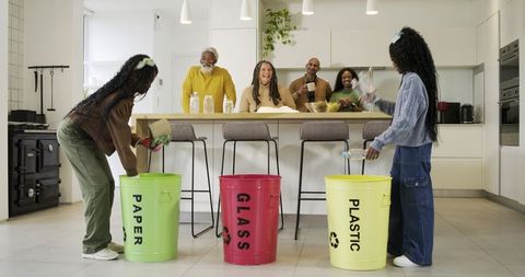 Family Sorting Recycling in Minimalist Kitchen, Children Separating Paper Glass Plastic