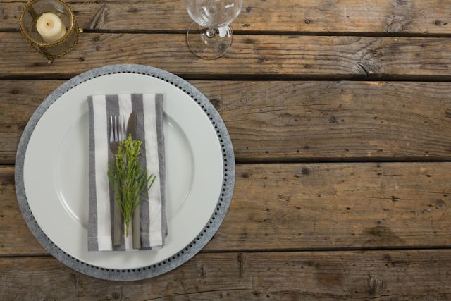 Elegant Table Setting with Striped Napkin and Greenery - Download Free Stock Photos Pikwizard.com