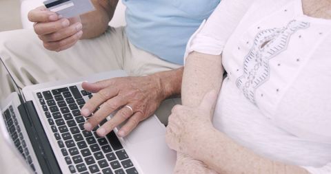 Senior Couple Online Shopping at Home with Credit Card