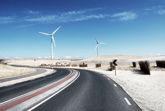 Desert Road with Wind Turbines under Clear Blue Sky - Download Free Stock Photos Pikwizard.com