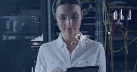 Caucasian Woman Working in Server Room with Digital Graphs - Download Free Stock Images Pikwizard.com