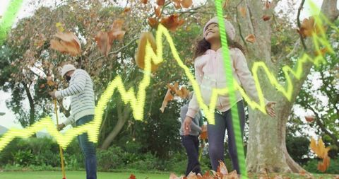 Multigenerational family enjoying autumn leaf play with child smiling and neon waveform
