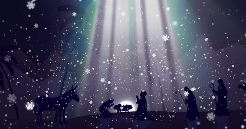 Enchanting christmas scene with falling snow over nativity silhouette