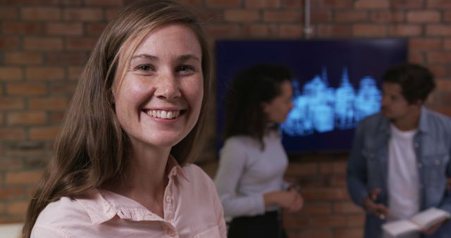 Smiling Businesswoman Standing in Modern Office During Team Meeting - Download Free Stock Images Pikwizard.com