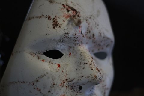 Creepy Bloodstained Mask Suggesting Horror Theme