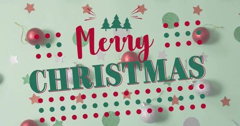 Merry christmas bold typography on pastel mint flatlay with baubles, confetti, festive dots