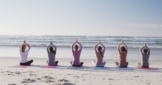 Group Yoga Session on Beach Practicing Meditation Pose at Sunrise - Download Free Stock Images Pikwizard.com