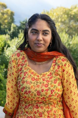 Indian woman in floral kurta enjoying nature