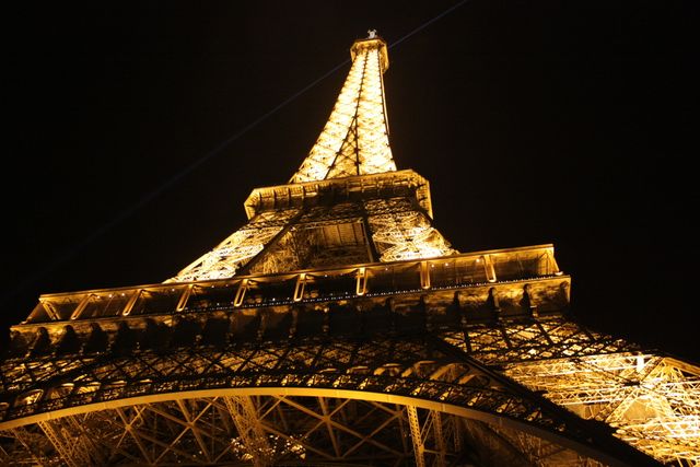 Eiffel Tower Illuminated at Night with Golden Lights - Download Free Stock Photos Pikwizard.com