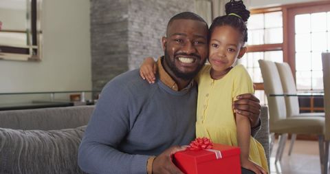 Father and Daughter Celebrating Together Holding Gift - Download Free Stock Images Pikwizard.com