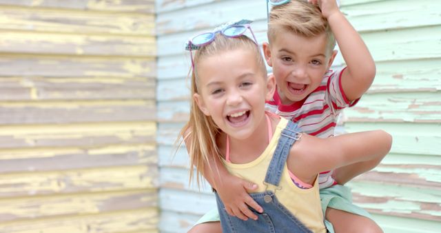 Two Happy Children Playing Piggyback Outdoors - Download Free Stock Images Pikwizard.com