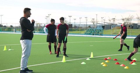 Field Hockey Coaching Session on Turf Pitch with Cones