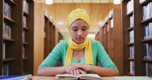 Female Student Reading Book in Library - Download Free Stock Images Pikwizard.com