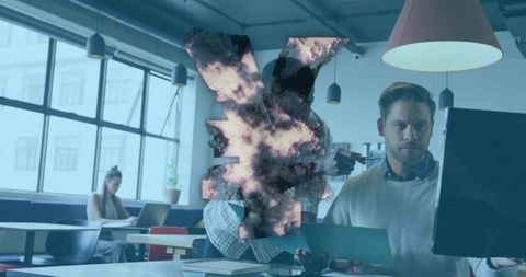 Man reviewing tablet at desktop in modern coworking office with glitch digital overlay