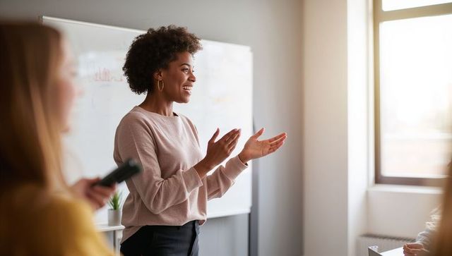 Black female corporate trainer leading engaging workshop in sunlit modern classroom