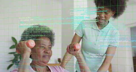 Senior woman lifting pink dumbbells while caregiver guiding wrist for gentle at-home strength