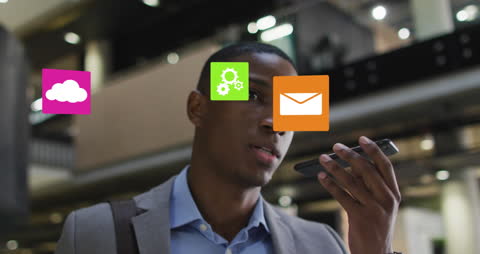 Businessman Using Smartphone with Digital Icons Overlaid