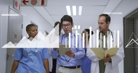 Diverse Medical Team Analyzing Data and Trends in Hospital Corridor