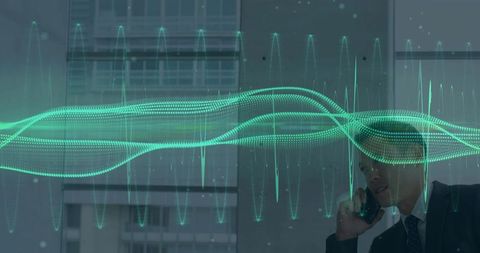 Businessman engaged in mobile communication with digital waveform overlay