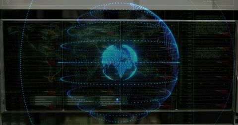 Holographic Blue Wireframe Globe Rotating Above Data Console with Network Dashboards
