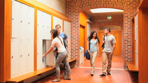 Students Walking in School Corridor Near Lockers Turning a Blind Eye to Classmates