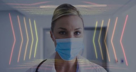 Confident doctor wearing mask in futuristic hospital environment