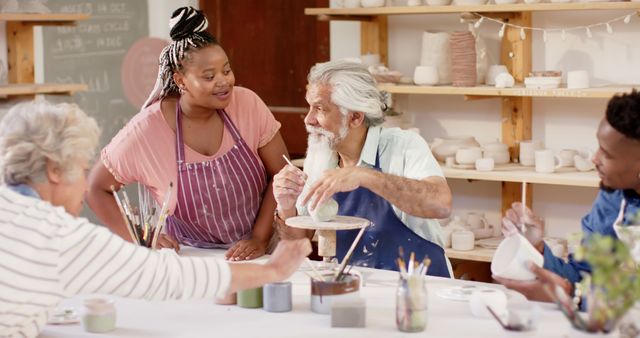 Diverse Group of Adults Engaging in Pottery Art Class Together - Download Free Stock Images Pikwizard.com