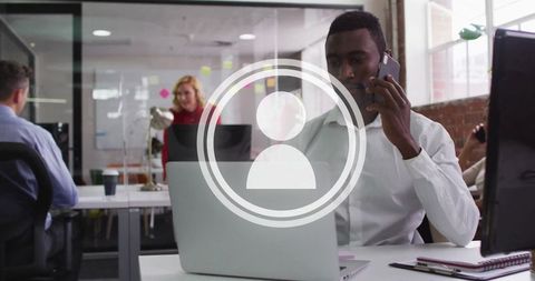 African American Man on Phone Working in Modern Office Setting