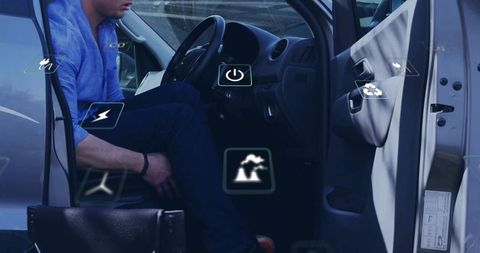 Professional man sitting in compact car checking dashboard with floating eco technology icons