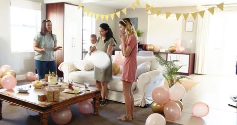 Diverse Friends Celebrating Baby’s Birthday with Joy and Laughter