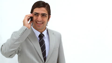Confident Businessman Smiling While Talking on Mobile