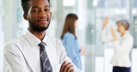 Confident Businessman with Crossed Arms in Office Environment - Download Free Stock Images Pikwizard.com