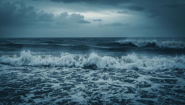 Moody storm surf crashing across nearshore with churning sea foam and dark clouds