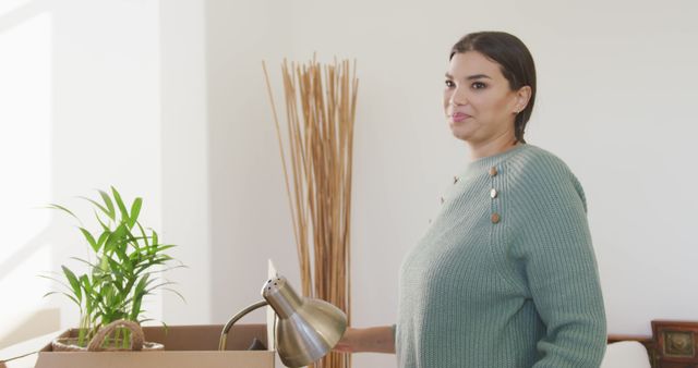 Woman Moving Into New Home Holding Lamp - Download Free Stock Images Pikwizard.com