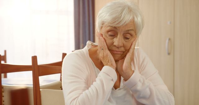 Lonely Senior Woman Sitting Thoughtfully at Home - Download Free Stock Images Pikwizard.com