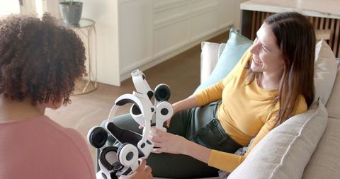 Diverse Friends Exploring Virtual Reality Headsets Indoors