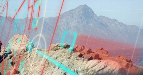 Mountain Range Overlooking Ocean with Digital Data Overlay