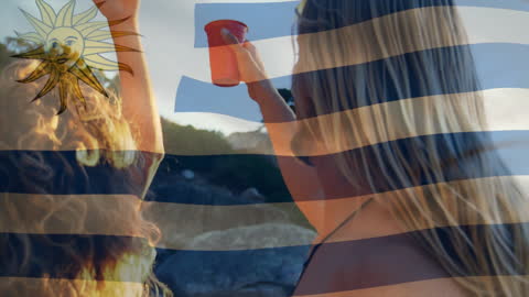 Joyful Gathering under Uruguay's Emblem with Toasting Friends Outdoors
