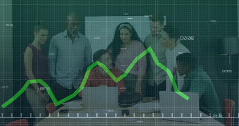Diverse Team Analyzing Downward Business Graph in Modern Office