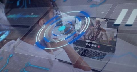 Mid-adult woman attending virtual meeting with augmented reality overlays at laptop desk