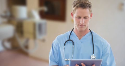 Young Male Doctor Accessing Digital Health Records in Hospital - Download Free Stock Images Pikwizard.com