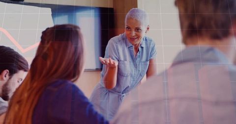 Confident executive presenting data in modern meeting room