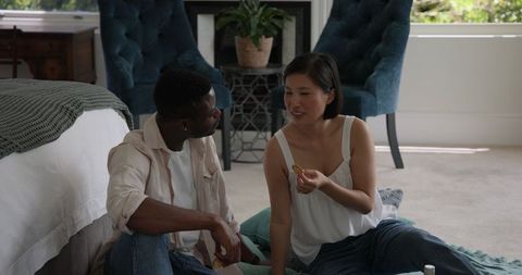Couple relaxing indoors having an intimate conversation