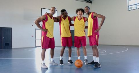 Diverse Basketball Team Strategizing on Court