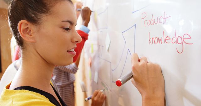 Focused Woman Writing on Whiteboard During Seminar - Download Free Stock Images Pikwizard.com