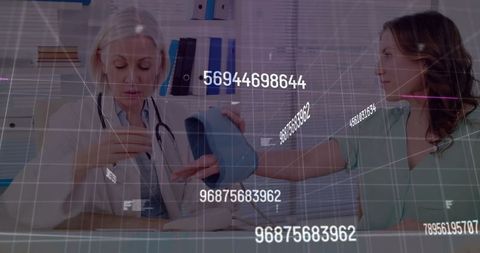 Doctor checking blood pressure highlighting medical data integration