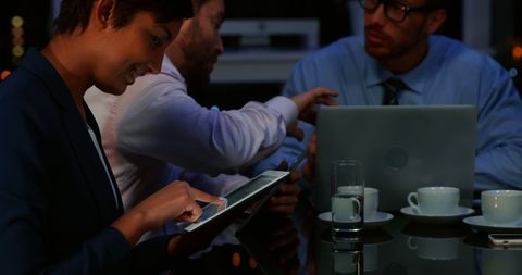 Late-night business meeting reflecting dedication and teamwork