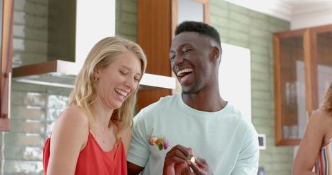 Couple Enjoying Laughter Together in Bright Modern Kitchen - Download Free Stock Images Pikwizard.com